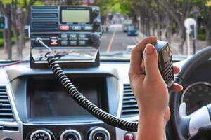 Handle PTT Speaker of Trunk Radio While Driving on an Open Road photo