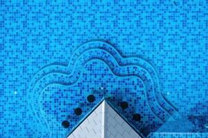 Stunning aerial view of a sparkling pool with unique shape and vibrant tiles photo