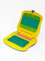 Colorful computer toy designed for kids featuring interactive letter and word activities for learning while playing photo