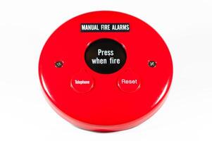Manual fire alarm button for emergency situations in public buildings photo