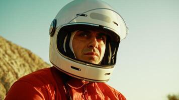 Astronaut With Helmet Looks Around At The Hostile Planet On Which He Landed photo