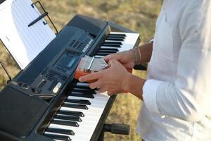 Piano Tuning Tool Used By Man Close Up photo