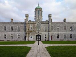 Old architecture University of Galway, quadrangle in Ireland, historical architecture and landmarks background photo