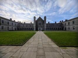 Epic University of Galway, quadrangle in Ireland, historical architecture and landmarks background photo