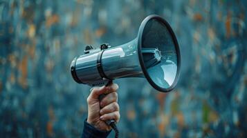 Hand holding megaphone public announcement communication voice message news broadcast protest demonstration opinion amplify speaker. photo