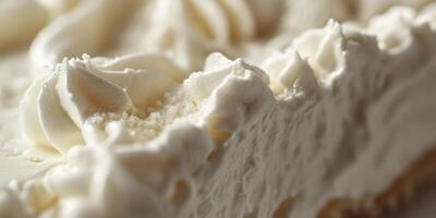 A close up of a piece of white cake with frosting photo