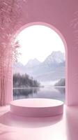 Serene mountain view from a pink arched window with a tranquil lake and snowy peaks. photo