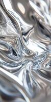 Abstract close-up of fluid metallic surface with flowing curves and reflections. photo