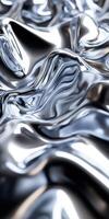 Shiny metallic surface with fluid, reflective texture creating abstract waves. photo