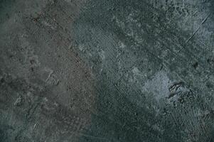 Background of dirty concrete floor with footsteps and lines on it photo