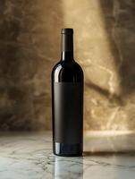 A bottle of wine sitting on a table photo