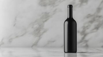 A black wine bottle sitting on a marble counter photo