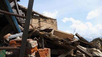 View to destroyed residential buildings at Kharkivska oblast. Ruined houses after bomb attacks on ukrainian territory from russia army. Consequences of russian invasion of Ukraine. Slow motion photo