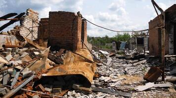 View to destroyed residential buildings at Kharkivska oblast. Ruined houses after bomb attacks on ukrainian territory from russia army. Consequences of russian invasion of Ukraine. Slow motion photo