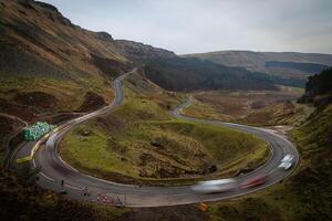 Cars driving on Horseshoe Pass in Wales photo