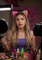 a woman in a purple shirt and cat ears is sitting at a table with makeup and other items. Beauty Vlogger Makeup Tutorial photo