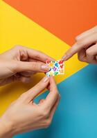 hands holding a colorful piece of nail mask on colorful background. Sharing Rainbow Nail Mask photo