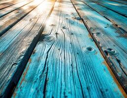 a wooden deck with sun shining through it. Rustic Blue Wood Planks photo