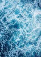 an aerial view of the ocean with blue water. Ocean Waves Texture photo