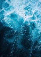 an aerial view of the ocean with waves. Ocean Embrace photo