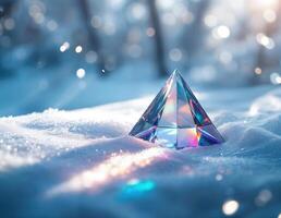 Magic crystal on snow with bokeh background, close-up. Crystal Pyramid in Winter photo
