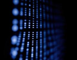blue binary code on a black background, computer generated abstract background, close up. Blue Matrix Lights photo