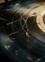 Old vinyl record with scratches and cracks. Shallow depth of field. Damaged Vinyl Record photo