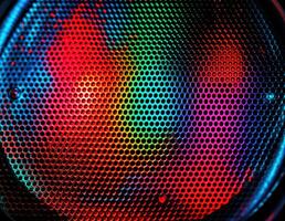 abstract background of a colored speaker with some holes in the it. Colorful Speaker Mesh photo
