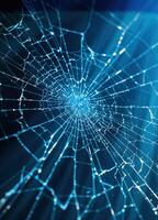 cracked windshield on blue background, macro photo, close-up. Cracked Screen Spiderweb photo