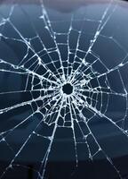 Broken glass on the car as a background. Close-up. Shattered Glass photo