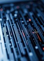 Sound mixer control panel, closeup of audio mixing console with shallow depth of field. Abstract Digital Circuit Background photo