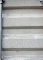 Corrugated metal texture with scratches and cracks. Industrial background. Corrugated Metal Texture photo