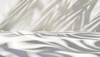 A serene scene of soft white sand with gentle shadows creating a tranquil atmosphere. photo