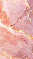 A smooth, pink marble texture with golden veins, ideal for backgrounds and design projects. photo