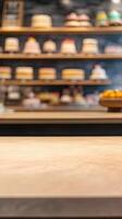 Light Brown Wooden Surface with Blurred Bakery Display of Cakes photo