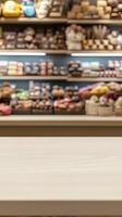 Light Beige Table Top in Front of Blurred Shelves of Food Products photo