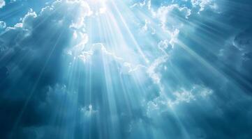 Radiant Light Breaking Through Clouds in a Serene Sky photo