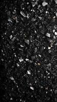 Black and Gray Granular Material with Gold Flecks photo