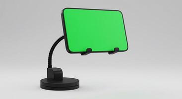 A green screen on a stand with a black base photo