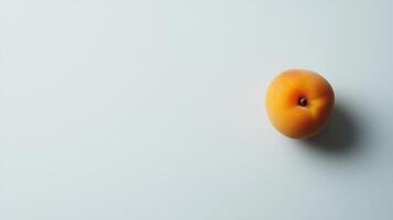A single peach on a white surface photo