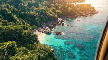 View from the window of a plane over the tropical forest and beach in thailand photo