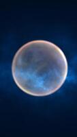 A glowing blue sphere surrounded by a cosmic mist, creating a surreal and futuristic atmosphere. The ethereal effect suggests space, technology, or fantasy elements video