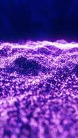 A mesmerizing field of tiny glowing purple particles forming a wave-like structure, representing energy flow and futuristic aesthetics video