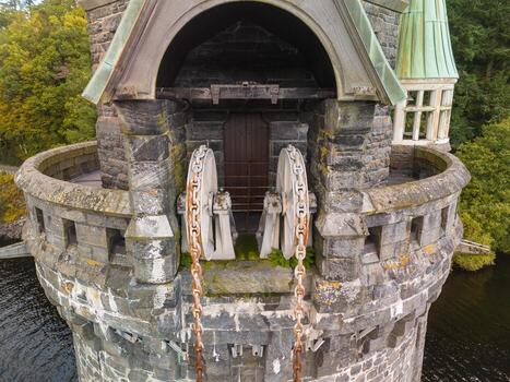 Old metallic winch mechanism being part of dam infrastructure photo