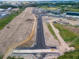 Aerial view of road construction site with workers building new infrastructure photo