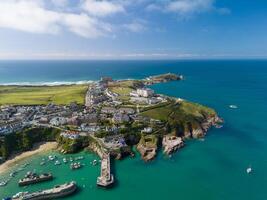 Newquay town and beaches from above on sunny day with blue sky and clouds photo
