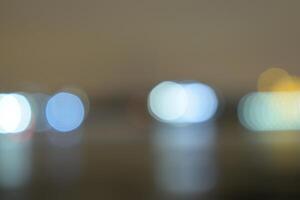 Colorful bokeh lights creating a beautiful background reflecting on a surface photo