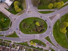 Aerial view of traffic flowing around a roundabout in a residential area photo