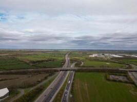 Highway crossing the countryside under a cloudy sky photo