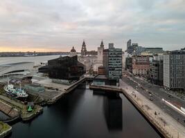 Liverpool city centre showing the liver building, port of liverpool building and the museum of liverpool at sunset photo